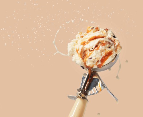 salted caramel scoop of ice cream flinging from scooper
