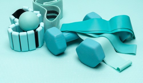 An array of the best at-home Pilates set equipment, all in turquoise blue.