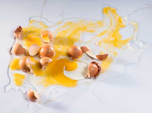 Eggs cracked and spilled on a counter