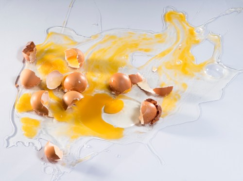 Eggs cracked and spilled on a counter