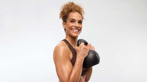 Peloton instructor Jess Sims holds a kettlebell