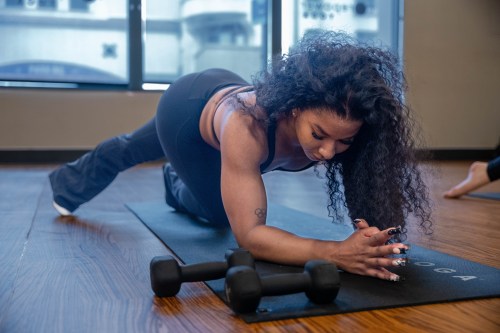 jordan chiles doing yoga on a ma