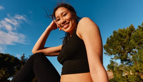 A woman smiles in this representation of your weekly horoscope for May 4 to 10, 2025.
