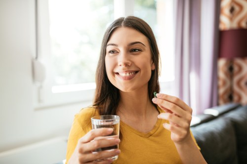 woman taking fish oil