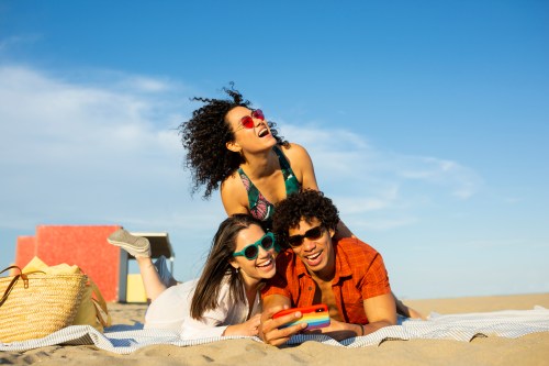 Friends taking a selfie with at the beach