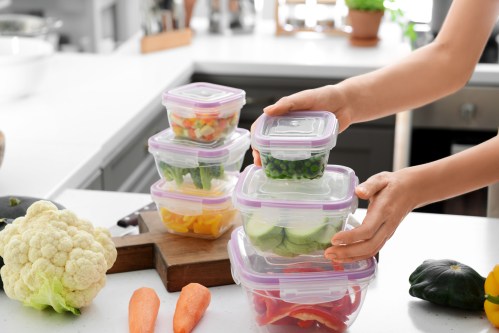 food storage containers in a brightly lit kitchen