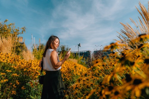 Young Asian woman enjoyment little moment in life. Connecting with nature. Mental health and self-care.